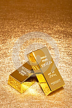 Gold bars on shiny golden background vertical