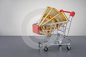 Gold bars in shopping trolley.