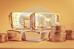 Gold bars and stack of gold coins. Background for finance banking concept. Trade in precious metals.