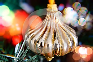 Gold bauble with bokeh background