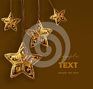 Gold beaded stars isolated on white