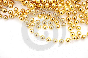 Gold beads isoletd on white background