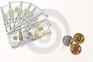 Gold Bit Coin BTC coins and bills of 100 dollars. Worldwide virtual internet cryptocurrency and digital payment system.