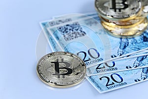 Gold Bitcoin and banknotes