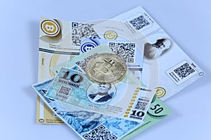 Gold Bitcoin and banknotes