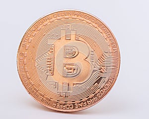 Gold bitcoin coin on a white background close-up. Physical bit coins. Digital currency. Cryptocurrency mining concept