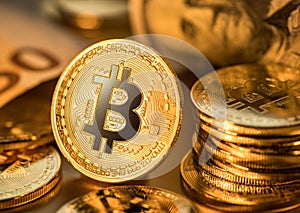 Gold bitcoin coins on a gold background. Symbol of electronic currency and blockchain technology