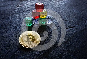 Gold bitcoin and stacked dice -- cryptocurrency investing