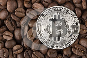 Gold Bitcoin surround by coffee bean