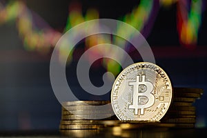 Gold Bitcoins with candle stick graph chart and digital background