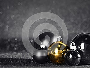 gold and black christmas balls on black