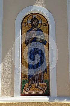 Gold and blue mosaic of bearded saint on Greek Island