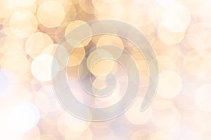 Gold bokeh background. Abstract glitter festive blur lights. Soft yellow christmas backdrop.