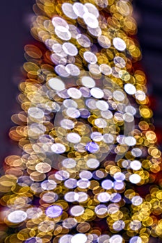 Gold bokeh lights soft focus background Christmas tree