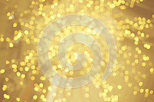 Gold bokeh sparkle glitter from light bulb abstract patterns for Christmas and Happy new year background