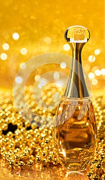 gold bottle parfume close-up dior bokeh background glitter macro light beautiful abstract blur texture photo