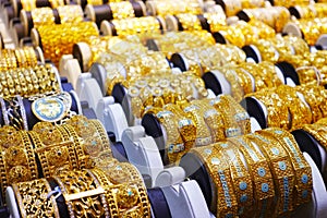 Gold bracelets in the display window of a jewelleries store in gold bazaar
