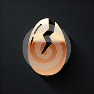 Gold Broken egg icon isolated on black background. Happy Easter. Long shadow style. Vector.