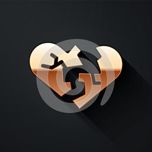 Gold Broken heart or divorce icon isolated on black background. Love symbol. Valentines day. Long shadow style. Vector