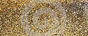Gold bronze glitter shine dots confetti. Abstract light blink sparkle defocus backgound