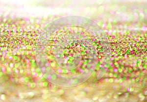 Gold bronze glitter shine dots confetti. Abstract light sparkle defocus backgound