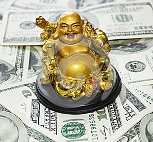 Gold Buddha on dollars