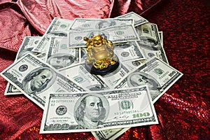 Gold Buddha on dollars