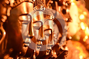 Gold Buddha head arranged selective focus.