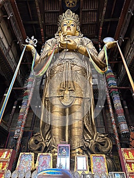 Gold Buddha statue at Gandantegchinlen Monastery in Ulaanbaatar Mongolia