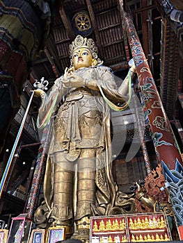 Gold Buddha statue at Gandantegchinlen Monastery in Ulaanbaatar Mongolia