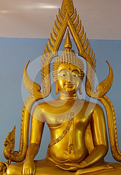 Gold Buddha statue inside temple shire