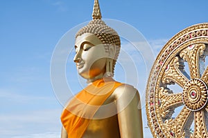 Gold buddha statue in Thai temple with clear sky.WAT MUANG, Ang Thong, THAILAND.