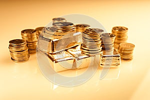 Gold bullions and stack of coins. Background for finance banking concept. Trade in precious metals.