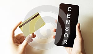 Gold card and phone with text disaster recover plan Censor in the female hands