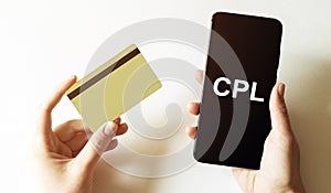 Gold card and phone with text disaster recover plan CPL in the female hands