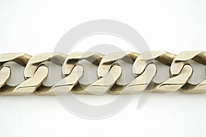 Gold chain bracelet on white background