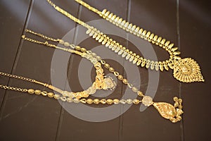 Gold chain on a brown background