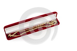 Gold chain in a red gift box