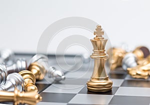 Gold Chess on chess board game for business metaphor leadership