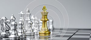 Gold Chess king figure on Chessboard against opponent or enemy. Strategy, Conflict, management, business planning, tactic, politic