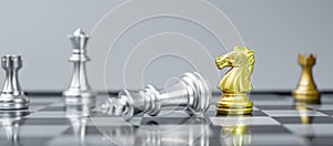 Gold Chess Knight figure stand out from crowd of enermy or opponent during chessboard competition. Strategy, Success, management,