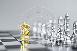 Gold Chess Knight horse figure on Chessboard against opponent or enemy. Strategy, Conflict, management, business planning,