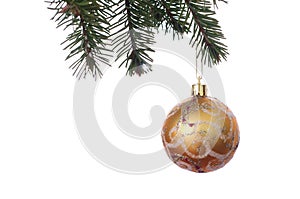 Gold Christmas balls with ornament on the green fir branch. Whit