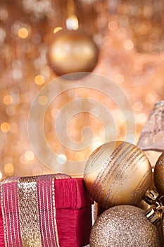 Gold christmas baubles and red box