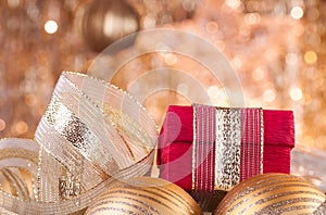 Gold christmas baubles and red box
