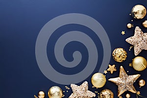 Gold Christmas decorations and baubles on dark blue background. Merry Christmas greeting card design, Happy New Year banner mockup