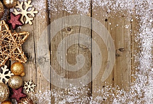 Gold Christmas ornament side border with snow frame on wood