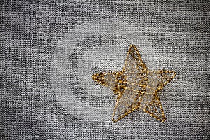 Gold Christmas star on grey background