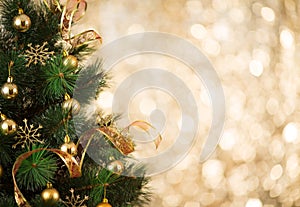 Gold Christmas tree background of defocused lights