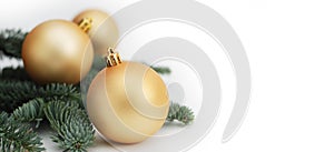 Gold Christmas Tree Bauble Decoration Ornament with Fir Branches Isolated. Banner.